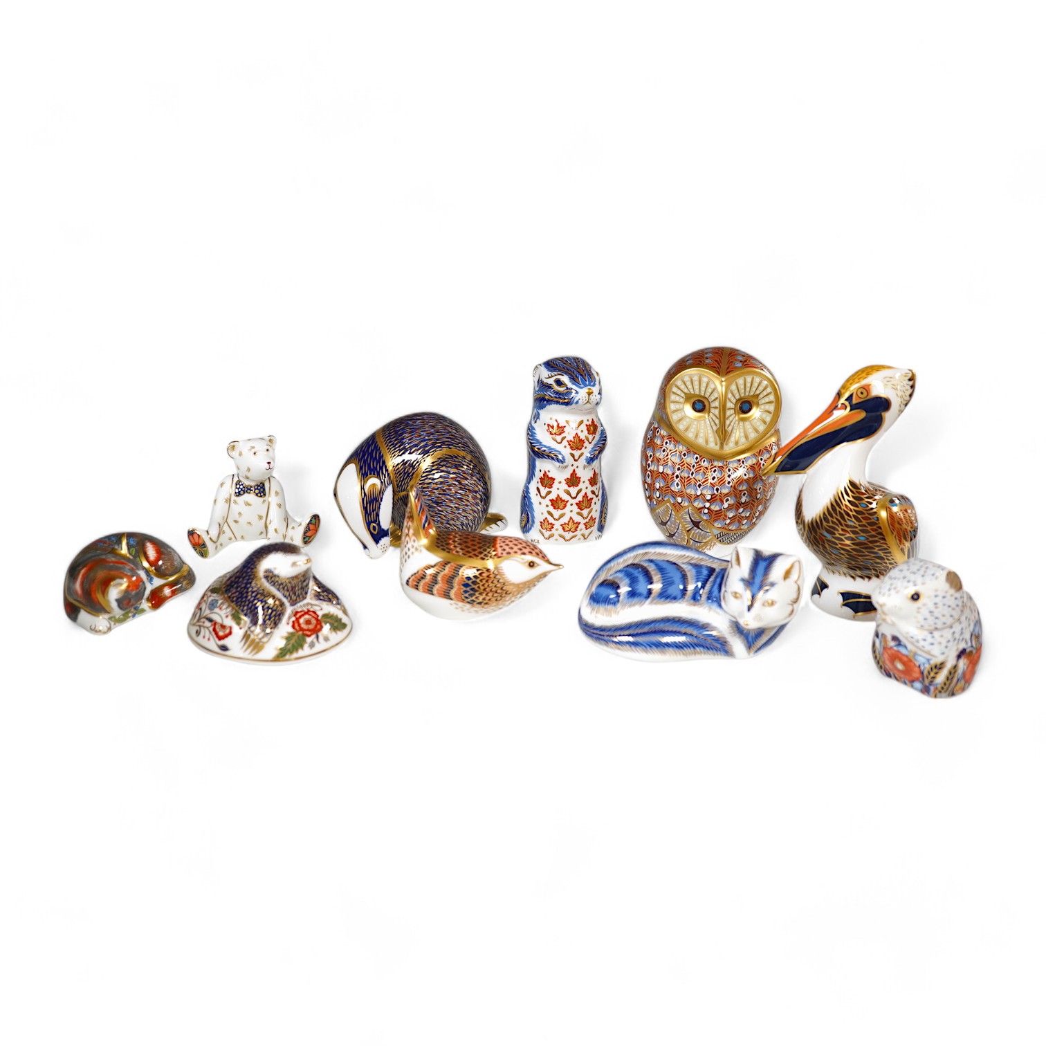 A collection of ten Royal Crown Derby animal paperweights, tallest pelican 13cm high. Condition - good